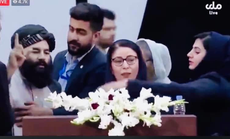 Female delegate, Asila Wardak, redressing mistreatment of another woman delegate interrupted by a Talib using expletives for protesting delegate. 