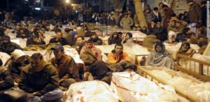 Hazaras sitting with nearly 100 victim coffins aftermath of Twin-Blast Terrorist Attack Jan102013, Quetta, Pakistan